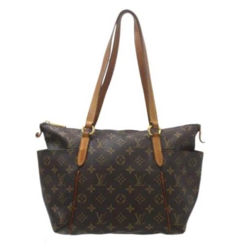 Pre-owned Fabric handbags Louis Vuitton Vintage , Brown , Dames