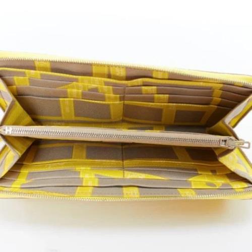 Pre-owned Leather wallets Hermès Vintage , Yellow , Dames