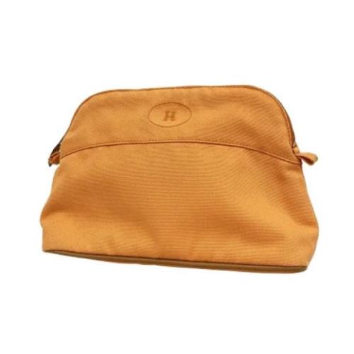 Pre-owned Canvas clutches Hermès Vintage , Orange , Dames