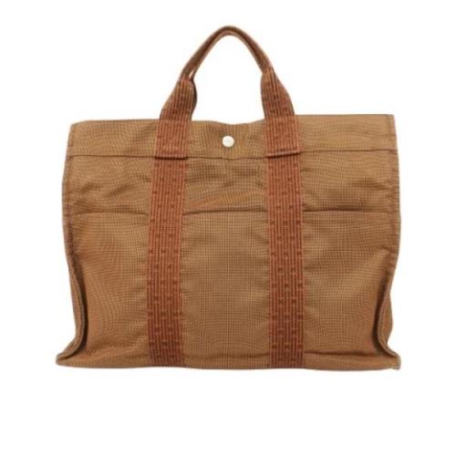 Pre-owned Canvas handbags Hermès Vintage , Brown , Dames