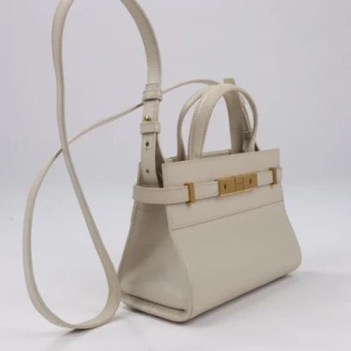 Pre-owned Leather handbags Yves Saint Laurent Vintage , Beige , Dames