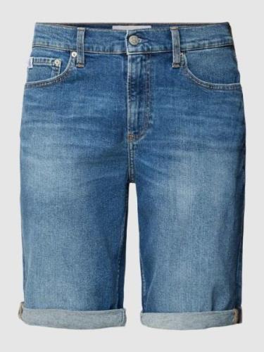 Korte slim fit jeans met labeldetail