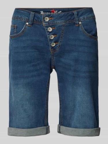 Korte regular fit jeans met asymmetrische knoopsluiting