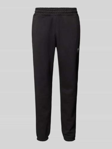 Tapered fit sweatpants met labelstitching