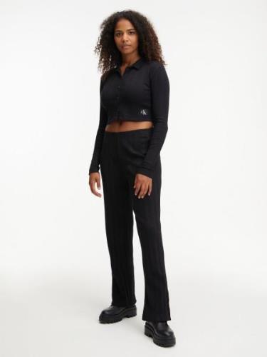 NU 20% KORTING: Calvin Klein Jerseybroek BADGE RIB STRAIGHT PANTS